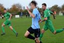 Jack Child heads for goal in Saturday\'s game at Martham.