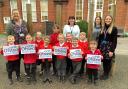 Staff and children from Ravensmere Infant School celebrating a positive Ofsted report. Picture: Ravensmere Infant School