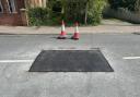 The patched over and repaired sinkhole on St John's Road in Bungay