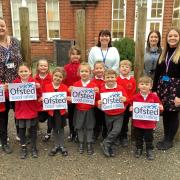 Staff and children from Ravensmere Infant School celebrating a positive Ofsted report. Picture: Ravensmere Infant School
