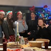 Kseniia Filipchuk, second from right, celebrating Christmas with friends she has made in Norfolk since arriving from Ukraine