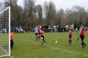 Alex Shreeve, far right in blue, fires home Bungay's winner at Thetford on Saturday.