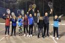Mixed tennis players celebrate winning the regional award