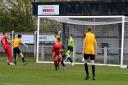 Andre Martens (14, in red) slots home Bungay's first goal on Saturday. Picture: Shaun Cole