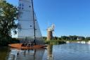 Snark sails past the historic mill at How Hill on the River Ant on the Norfolk Broads