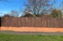 The council vehemently object to the fence - demanding it be reduced to one metre or removed