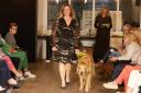 Blind model Lana Hempsall and her guide dog Zorin take to the catwalk at the charity fashion show