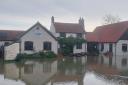 Rising water on Monday has left the Geldeston Locks Inn out of action throughout the week. Staff have said they will bounce back. Picture - The Locks Inn Community Pub