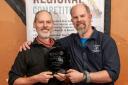Phil Halls (left) of Grain Brewery accepts the historic award from Buster Grant of SIBA