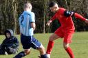 Andre Martens (red shirt) toys with an opponent  during Saturday's game at Thorpe. Picture: Shaun Cole
