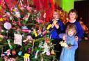 Alisha, Rhea and Sydney Foster help decorate the Beccles gymnastics club tree.