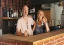 New pub owners Jo and Frank Butt behind the bar at the Angel Inn, Loddon, after picking up the keys.