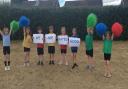 Pupils in the Woodpecker class at Ditchingham Church of England Primary Academy celebrate their 'Good' Ofsted rating.