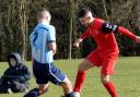 Andre Martens (red shirt) toys with an opponent  during Saturday's game at Thorpe. Picture: Shaun Cole