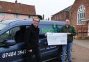 Chris Sadler, Treasurer of the Bungay Labour Party, presents a cheque to Matthew Scade, Project Manager of the Waveney Foodbank