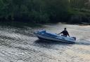 Nathan Strowger pictured driving the boat which capsized on Monday night