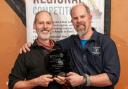 Phil Halls (left) of Grain Brewery accepts the historic award from Buster Grant of SIBA
