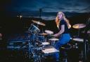 Grace Ellis on stage in front of a crowd of 35,000 playing drums with The Killers at Carrow Road in 2022. Picture: Rob Loud