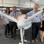 From left, NEBOair's Kerry Wilmot and Adam Hammett and SaxonAir''s John Dewing and Rebekah Hill at Farnborough International Airshow 2022 flanking a Pipistrel Velis Electro