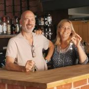 New pub owners Jo and Frank Butt behind the bar at the Angel Inn, Loddon, after picking up the keys.