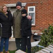Joshua, Bernice, Richard and Callum Higgins at their home in Denton which has been wrecked by that they believe to have been a minature tornado. Picture: Danielle Booden
