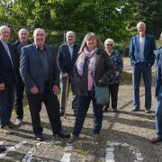 David Bland, Paul Gurbutt, Adrian Crockett, Norman Brooks, Jon Smith, Wendy Summerfield, Sheila Smith, Steve Larkin and Dave Howson, trustees of the Worlingham Community Facility, at the site of the former Worlingham Primary School where Worlingham