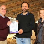 Fen Farm Dairy near Bungay has won the global #WeAreDairy Award. Pictured from left are Ian Joseph of Deosan, Jonny Crickmore of Fen Farm, and Hattie Thompson of Promar