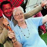 Dot Kent from Seething raised thousands of pounds for the village of Seething over the years. Supplied picture of Dot at a charity event with BBC TV star Stewart White in 2013.