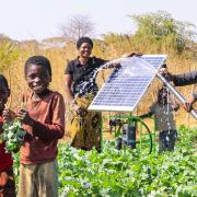 A farming family in Zambia with a solar irrigation system supplied by Bungay-based firm Futurepump