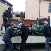 Brian Cloke, centre, Tony Sprake, right, and others delivering sandbags at The Staithe in Bungay.