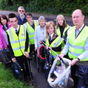 Former town mayor Hugh Taylor, with former mayor Caroline Topping, volunteers and students from Sir John Leman High School take part in a litter pick around the town.