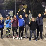 Mixed tennis players celebrate winning the regional award
