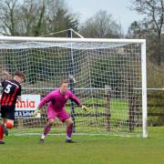 Having left defenders in his wake, Charlie McAra slots home Bungay's second goal on Saturday. Picture: Shaun Cole