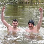 Adam Bedwell (left) and Sam Riseborough (right) splash for joy in The Staithe, RIver Waveney, in Bungay as they complete the March Cold Water Challenge