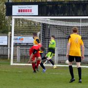 Andre Martens (14, in red) slots home Bungay's first goal on Saturday. Picture: Shaun Cole