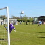Jack Child, out of picture, sees his opening goal curl into the top corner past the keeper's despairing dive.