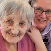 A smiley resident and carer at the care home in Beccles