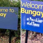 The new town sign, pictured on the left, before the vandalism, pictured on the right