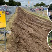 Cars and vans having to be pushed to safety from muddy tracks at Latitude 2023