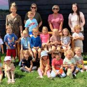 Some nursery pupils and staff ( left to right - Lucy Beckham, proprietor Kim Harper, manager Nina Kendrick and apprentice Tabitha Myers) at Bugs Café, Flixton near Bungay, celebrating the end of term and the end of an era.