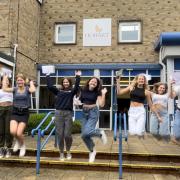 Hobart High School students jumping for joy after collecting their GCSE grades