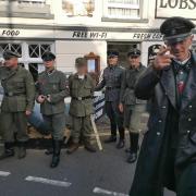 The group are at the centre of a bitter row after appearing in Sheringham in German military uniforms