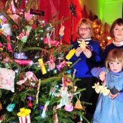 Alisha, Rhea and Sydney Foster help decorate the Beccles gymnastics club tree.